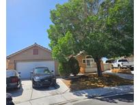 Charming single story home with a two car garage and mature landscaping in a desirable neighborhood at 2631 Bed Knoll Ct, North Las Vegas, NV 89031