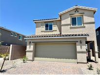Two story home with a two car garage and brick driveway at 3402 La Cura Ave # Lot 69, Las Vegas, NV 89141