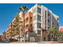 Beautiful multi-story building with modern architectural details and a blue sky at 55 E Agate Ave # 202, Las Vegas, NV 89123