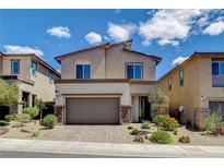 Beautiful two-story home featuring stylish design elements and a well-manicured front yard at 8898 Sasquatch Run Ave, Las Vegas, NV 89166