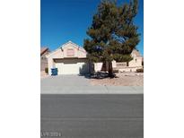 Charming single-story home featuring a two-car garage and a well-maintained gravel yard at 9312 Yucca Blossom Dr, Las Vegas, NV 89134