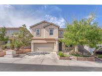 Charming two-story home showcasing manicured landscaping, neutral colors, and an attached two-car garage at 10432 Britton Hill Ave, Las Vegas, NV 89129
