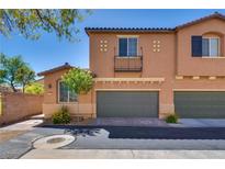 Charming two-story townhome with a two-car garage and well-maintained landscaping at 1139 Via Partito, Henderson, NV 89052