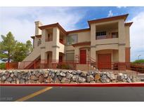 Inviting multi-Gathering home featuring warm stucco and accessible entrances with well maintained landscaping at 1608 Sussex St # 204, Las Vegas, NV 89144