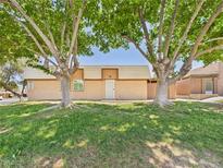 Charming single-story home with well-maintained lawn and mature trees at 3654 Villa Knolls South Dr, Las Vegas, NV 89120