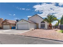 Charming single-story home featuring a well-maintained front yard and an attached two-car garage at 3811 Twinkle Star Dr, Las Vegas, NV 89115