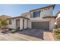 Modern two-story home with a brick driveway and attached two-car garage at 4289 Sunrise Flats St, Las Vegas, NV 89135