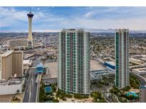 A high-angle shot showcases two modern high-rise buildings against the Las Vegas skyline at 322 Karen Ave # 2804, Las Vegas, NV 89109
