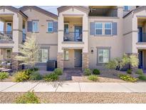 Charming townhome featuring a private balcony and well-maintained landscaping at 664 Foam Flower Ln, Henderson, NV 89015
