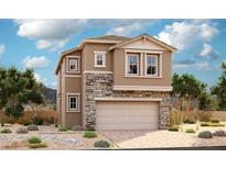 Two-story home featuring stone accents, a two-car garage, and desert landscaping against a bright, sunny sky at 7213 Banksia St, North Las Vegas, NV 89084