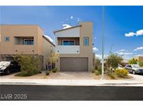 Two-story home features modern architecture, neutral tones, a two-car garage, and low-maintenance landscaping at 7777 Vino Vranec Ct, Las Vegas, NV 89113