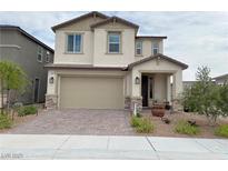 Charming two-story home with a neutral color palette, landscaped yard, and a two car garage at 933 Hunter Shores Ave, North Las Vegas, NV 89084