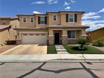 Charming two-story home featuring a well-maintained front yard and a two-car garage at 9604 Vital Crest St, Las Vegas, NV 89123
