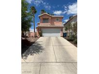 Charming two-story home with a spacious driveway and well-maintained landscaping at 1853 Citroen St, Las Vegas, NV 89142