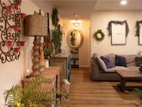 Inviting living room with wood-look floors and decorative details, creating a warm atmosphere at 2050 W Warm Springs Rd # 411, Henderson, NV 89014