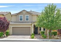 Charming two-story home featuring a two-car garage and a well-maintained, landscaped front yard at 3171 Biccari Ave, Henderson, NV 89044