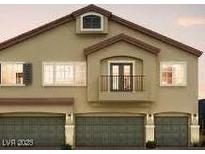 Charming three-story townhome with three car garage and a small balcony with double doors at 4645 Fuchsia Nights Ave # 103, North Las Vegas, NV 89084
