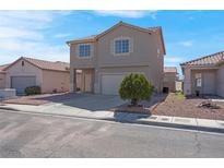 Two story home with desert landscaping and a two car garage under a blue sky at 8725 Russet Hills Ct, Las Vegas, NV 89147