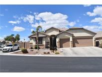 Charming single-story home with a desert landscape, two-car garage, and inviting curb appeal at 8928 Reining Spur Ave, Las Vegas, NV 89143