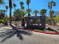 Community entrance with manicured landscaping, palm trees, and attractive Sedona on the Boulevard signage at 9000 Las Vegas Blvd # 2097, Las Vegas, NV 89123