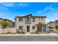 Charming two-story home featuring stylish stucco and gray accents, and a well-maintained landscaped yard at 12107 Frost Lime Rd # 1, Las Vegas, NV 89183