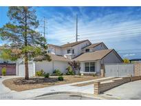 Charming two-story home featuring a well-manicured front yard and neutral color palette at 7726 Keating Cir, Las Vegas, NV 89147