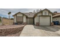 Charming single-story home with neutral siding, rock accents, and an attached garage at 901 Clipper Dr, Henderson, NV 89015