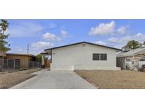 Charming single-story home featuring a well-maintained yard and a classic architectural style at 1424 Balzar Ave, Las Vegas, NV 89106