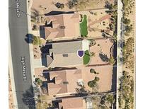 Aerial view of the property featuring a manicured backyard with desert landscaping and a small patch of artificial grass at 1846 High Mesa Dr, Henderson, NV 89012