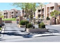 Attractive condo complex featuring well-maintained landscaping and secure gated access at 2171 Bay Club Dr # 103, Laughlin, NV 89029