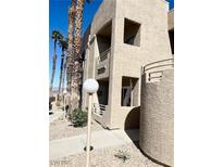 Multi-story condominium building featuring a textured exterior and small balconies at 2171 Bay Club Dr # 103, Laughlin, NV 89029