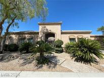 Charming single-story home with desert landscaping and a secure gated entry at 4565 Riva De Romanza St, Las Vegas, NV 89135