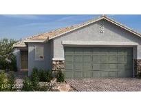 Charming single-story home featuring a neutral color scheme, desert landscaping and a two-car garage at 5941 Violet Crown St, North Las Vegas, NV 89081