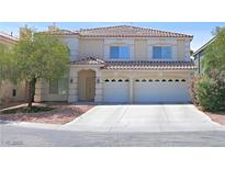 Two-story home with neutral stucco, red tile roof, front garden, and two-car garage at 6269 Bold Regatta Ct, Las Vegas, NV 89139