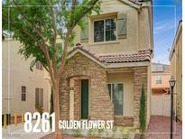 Charming two-story home features a stone facade, tiled roof, and well-maintained landscaping at 8261 Golden Flowers St, Las Vegas, NV 89139