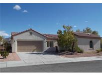 Charming single-story home featuring a tile roof and a two-car garage at 2138 Fort Halifax St, Henderson, NV 89052