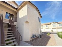 Inviting condominium exterior with stairs leading to the upper level at 4941 Black Bear Rd # 202, Las Vegas, NV 89149