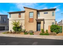 Modern two-story home with desert landscaping and a welcoming front entrance under a bright blue sky at 6141 May River St, Las Vegas, NV 89148