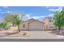 Charming single-story home with a two-car garage and low-maintenance landscaping at 6705 Frances Celia Ave, Las Vegas, NV 89122