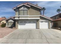 Charming two-story home with a two-car garage and well-maintained landscaping at 6736 Quinella Dr, Las Vegas, NV 89103