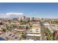 Expansive aerial view of the downtown area featuring a mix of buildings, streets, and scenic mountain views at 900 Las Vegas Blvd # 1113, Las Vegas, NV 89101