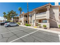 Exterior view of a well-maintained two-story condo with parking at 905 Sulphur Springs Ln # 101, Las Vegas, NV 89128