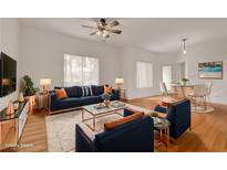 Bright living room with modern decor, plush rug, and stylish furnishings at 9303 Gilcrease Ave # 1245, Las Vegas, NV 89149