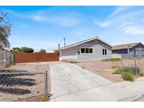 Charming single-story home featuring a well-maintained yard, driveway, and fenced perimeter at 2257 Colebrook St, Las Vegas, NV 89115