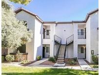 Inviting two-story condo with outside staircase and well-maintained landscaping at 2615 W Gary Ave # 1085, Las Vegas, NV 89123