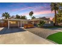 Charming single-story home with desert landscaping, palm trees, and a brick-paved driveway at 2617 Mason Ave, Las Vegas, NV 89102