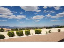 The beautiful backyard boasts desert landscaping, a block wall, and stunning mountain views at 2904 Bow Bridge Dr, Las Vegas, NV 89134