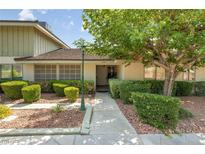 Charming single-story home featuring a well-maintained front yard with mature trees and lush landscaping at 3062 El Camino Ave, Las Vegas, NV 89102