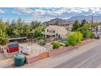 Charming home with tile roof, horse property, barn, mountain views, and ample space for animals at 5180 N Dapple Gray Rd, Las Vegas, NV 89149