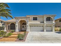 Charming two-story home with stucco exterior, tiled roof, three-car garage, and manicured front yard at 9208 November Breeze St, Las Vegas, NV 89123